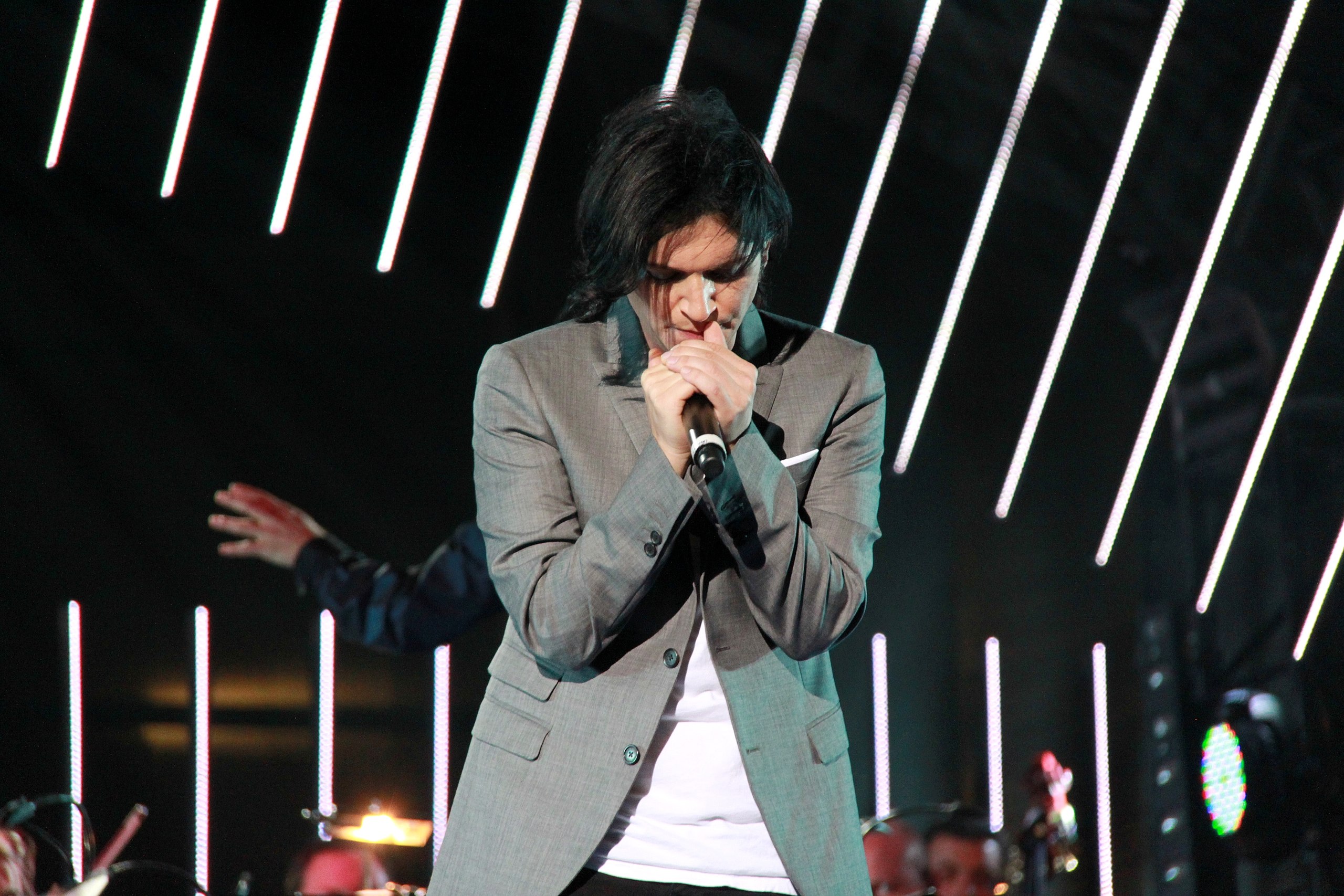 Brian Molko Performing on stage.