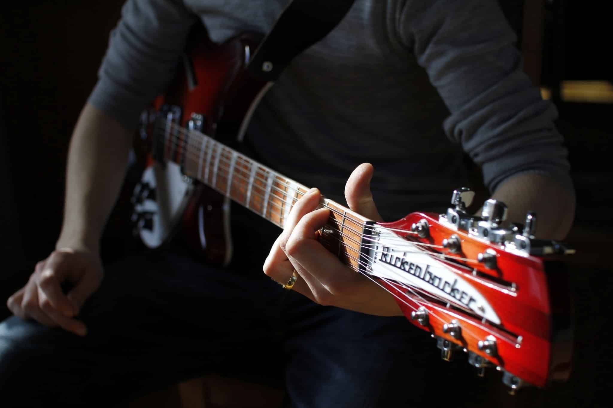 A guitarist holding a Rickenbacker